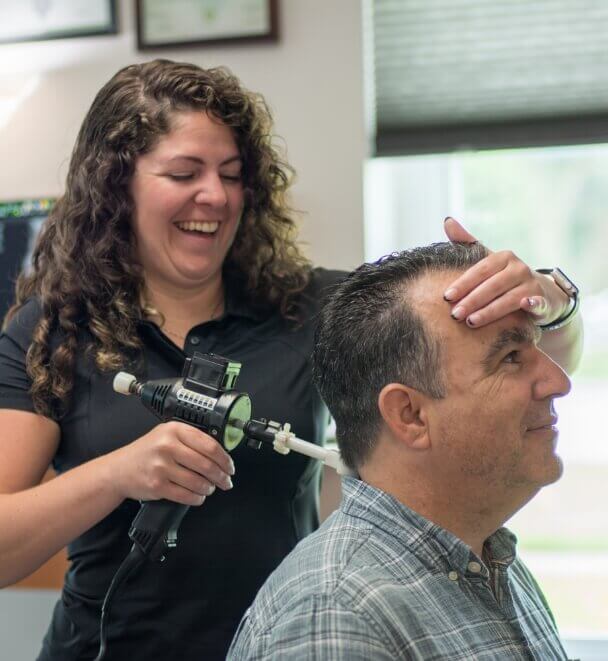 adjusting patient with tool