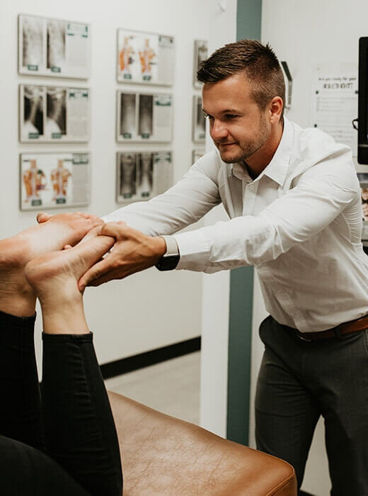 doctor looking at feet