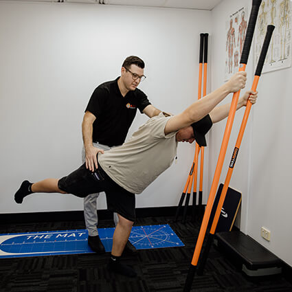 Shailer Park Chiropractor Dr. Luke helping man with physical therapy