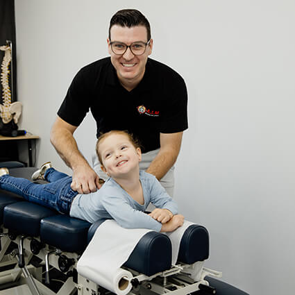 Shailer Park Chiropractor Dr. Luke adjusting a young girl