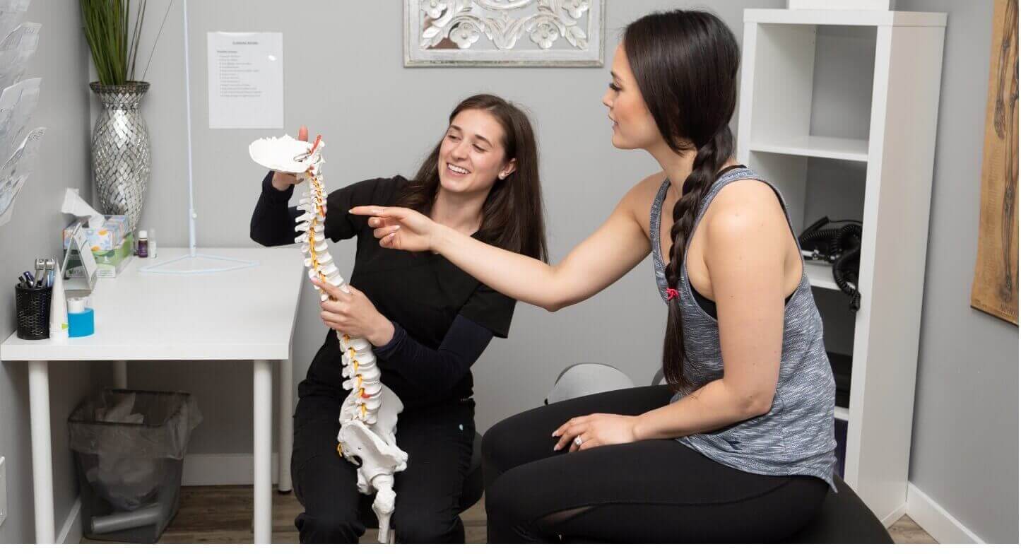 Doctor and patient spine demonstration