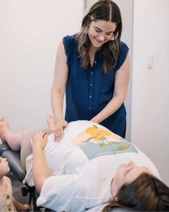 Dr. Dana adjusting pregnant lady