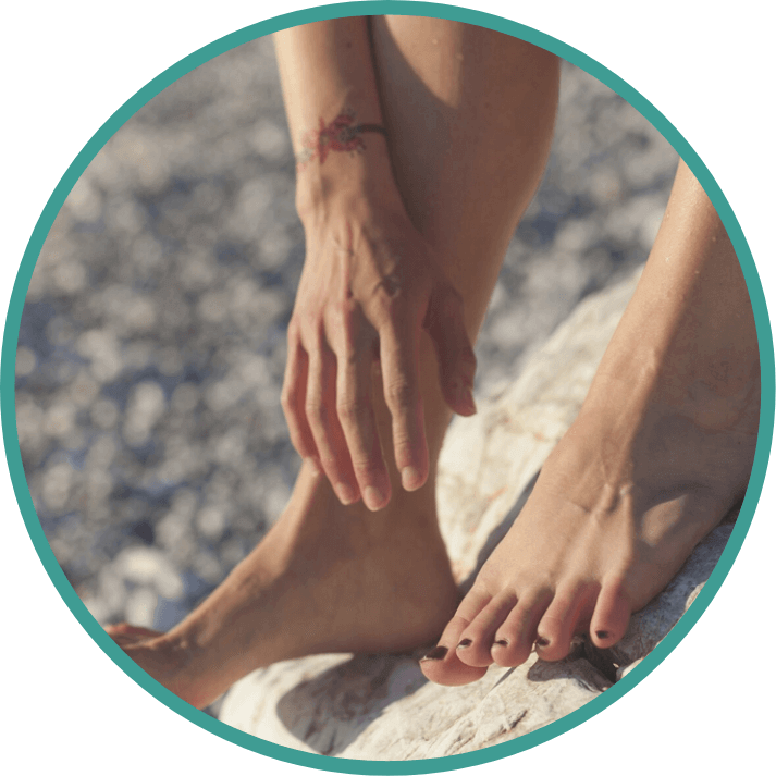 feet resting on a rock