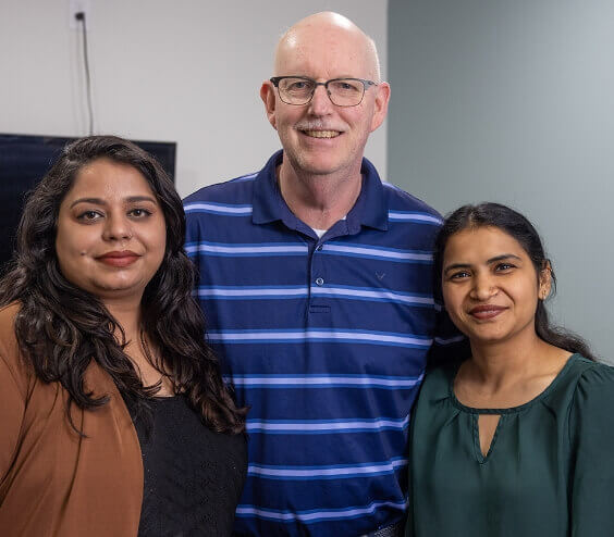 Dr. Prii posing for photo with two women