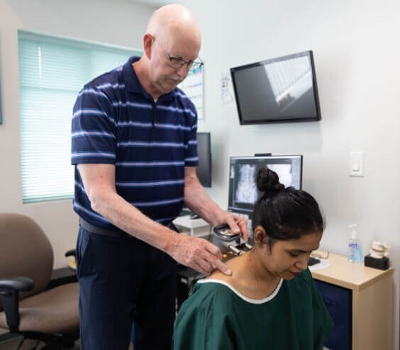 Dr. Prii treating a female patient