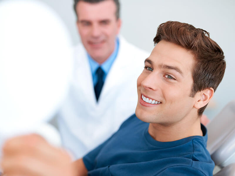 Man smiling in dental chair