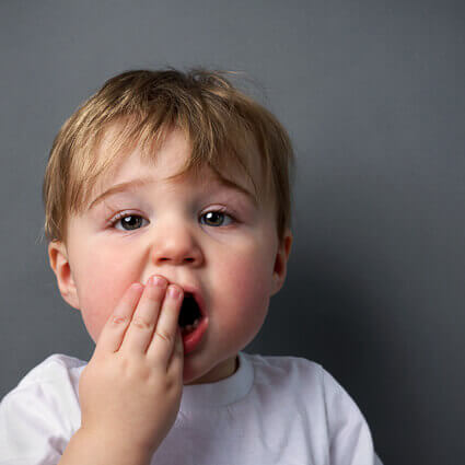 Toddler-covering-mouth