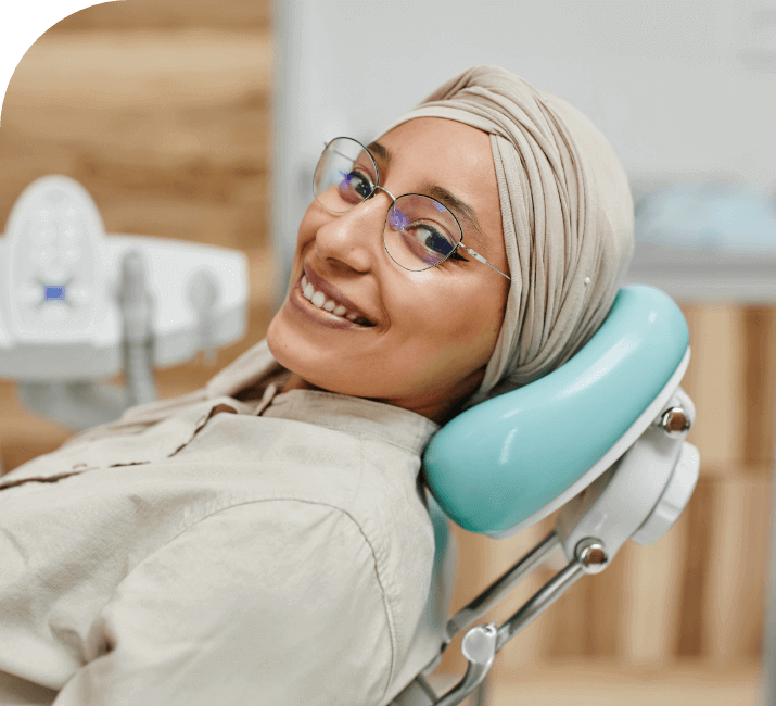 female patient smiling in dental chair