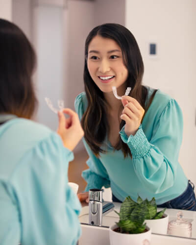 woman looking in mirror