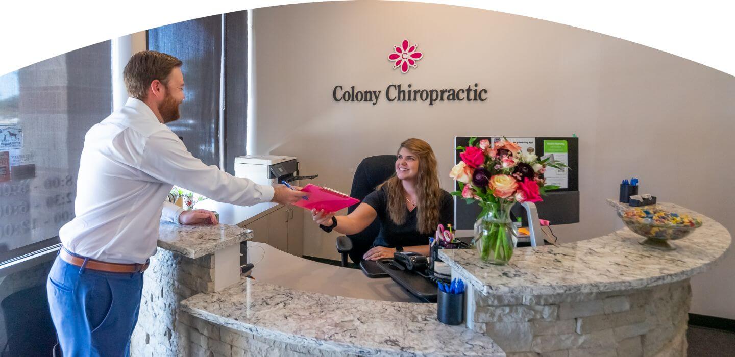 The Colony patient in consultation at Colony Chiropractic