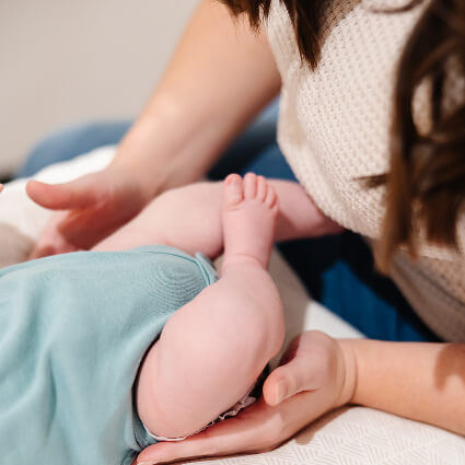 Touching baby's legs