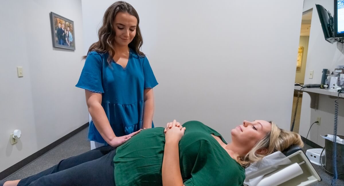 The Colony chiropractor adjusting pregnant patient