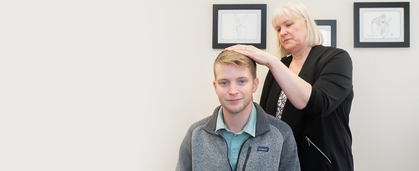 Yorkville chiropractor Dr. Cornish adjusting a male patient