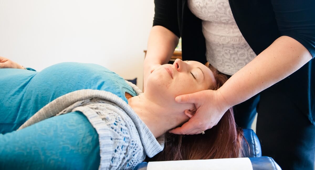 Yorkville patient receiving a neck adjustment at Cornish Chiropractic