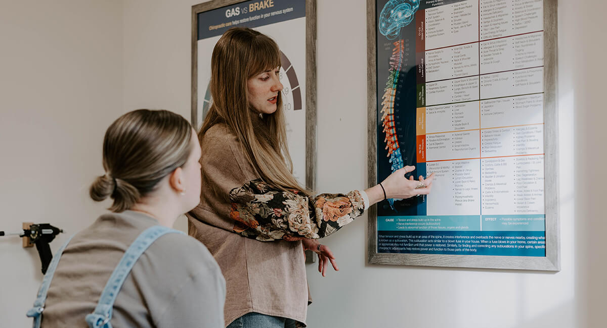 Doctor showing patient infographic