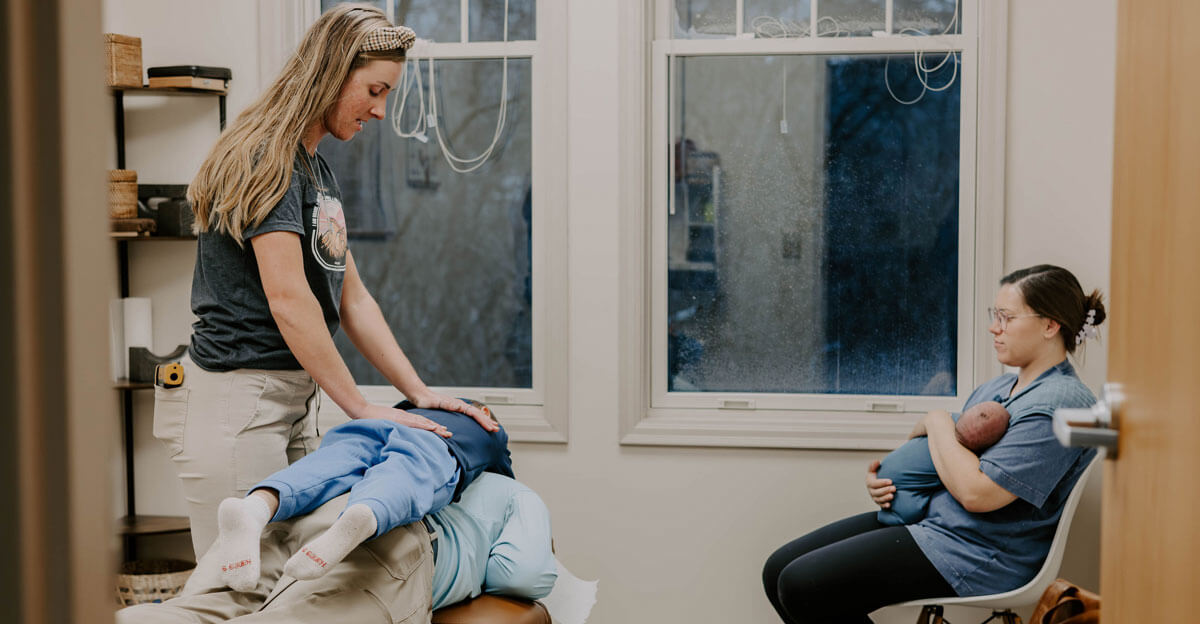 Family in adjusting room at Transform Chiropractic Wellness Center