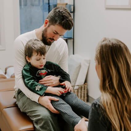 Dr. Stephanie with man and young son