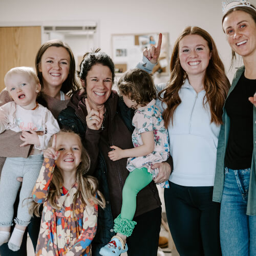 Shoreview chiropractor smiling with kids and patients