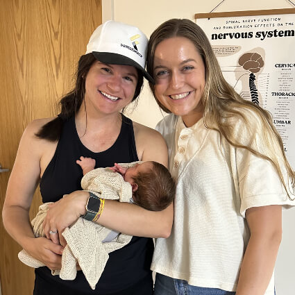 Shoreview chiropractor with a mom and her baby