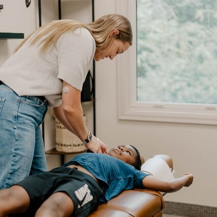 child having neck adjusted