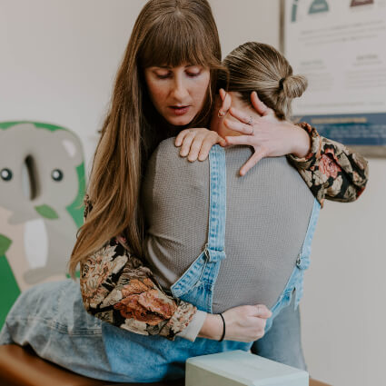 Doctor adjusting patients back