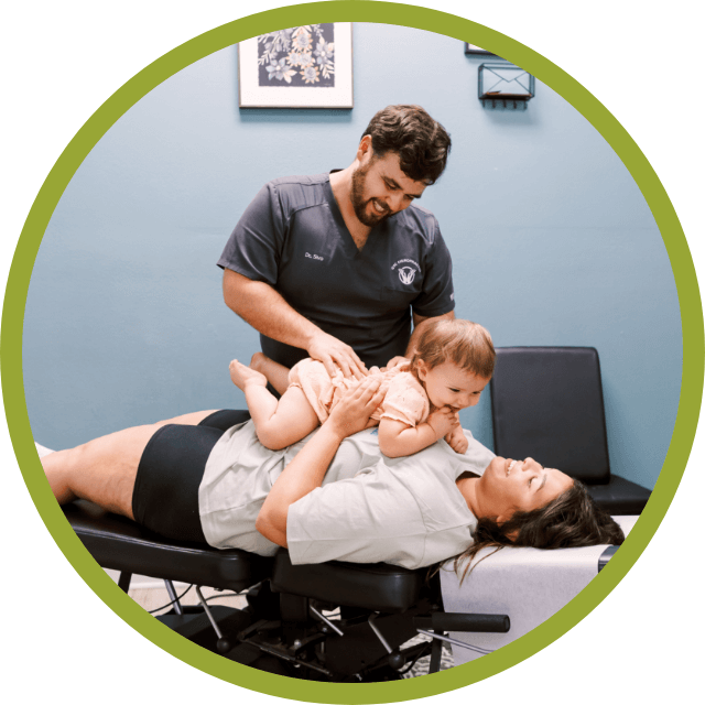 Grain Valley Chiropractic Chiropractor adjusting baby