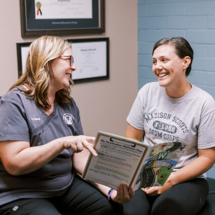 Dr. Catherine consulting with patient