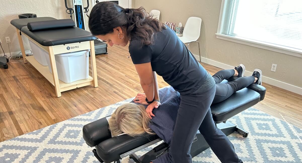 Roanoke chiropractor Dr. Roberts adjusting patient's back