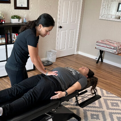 Roanoke chiropractor Dr. Andrea Roberts adjusting a pregnant lady