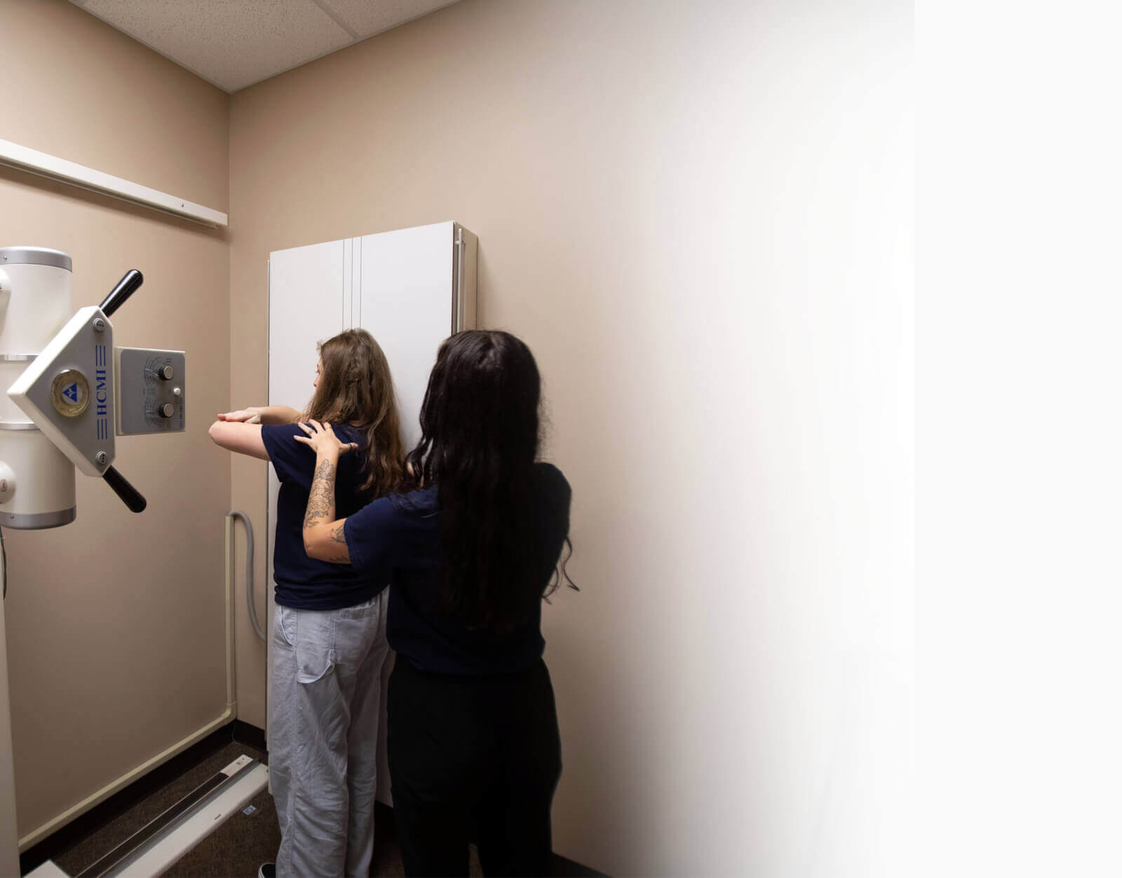 Millard Family Chiropractic & Wellness staff member preparing patient for x-ray