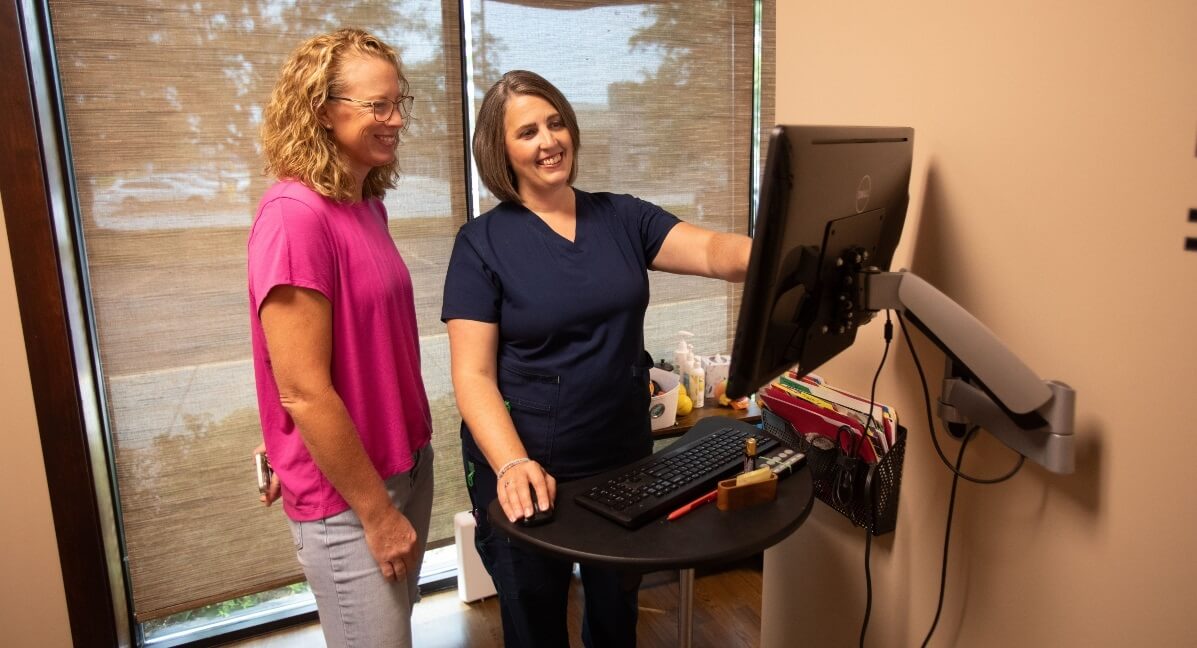 Omaha chiropractor Dr. Millard explaining results to  patient