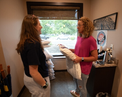 Patient interacting with Millard Family Chiropractic & Wellness staff