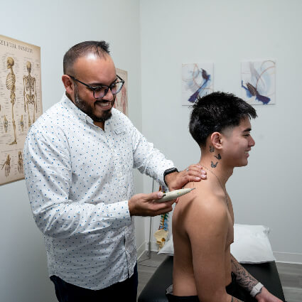 Acupuncture on man's shoulder