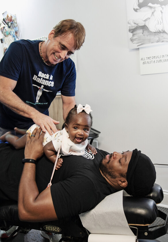 Summerville Chiropractor Dr. Mike adjusting baby