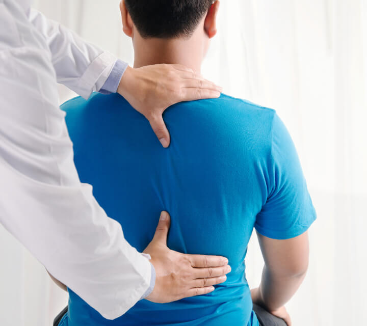 man having his back adjusted