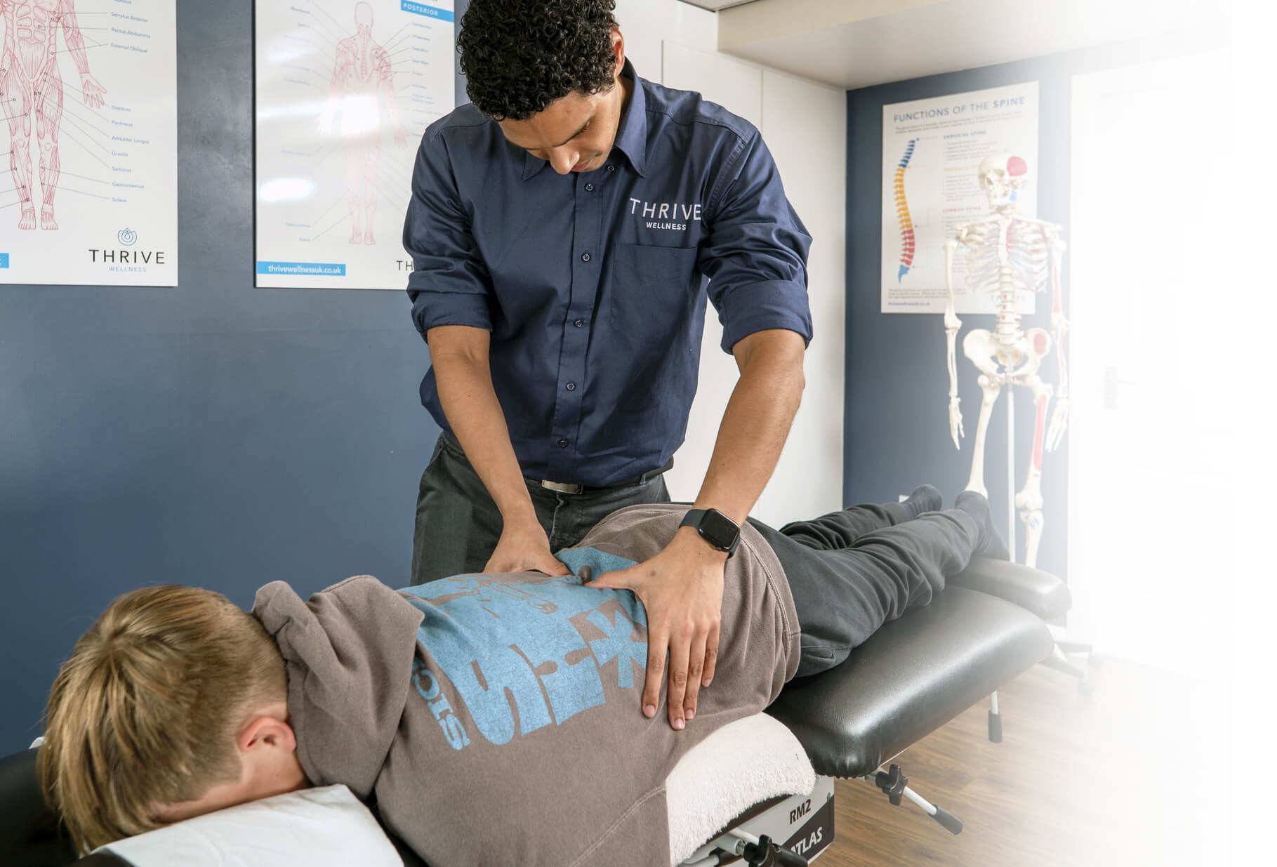 woman having neck adjusted