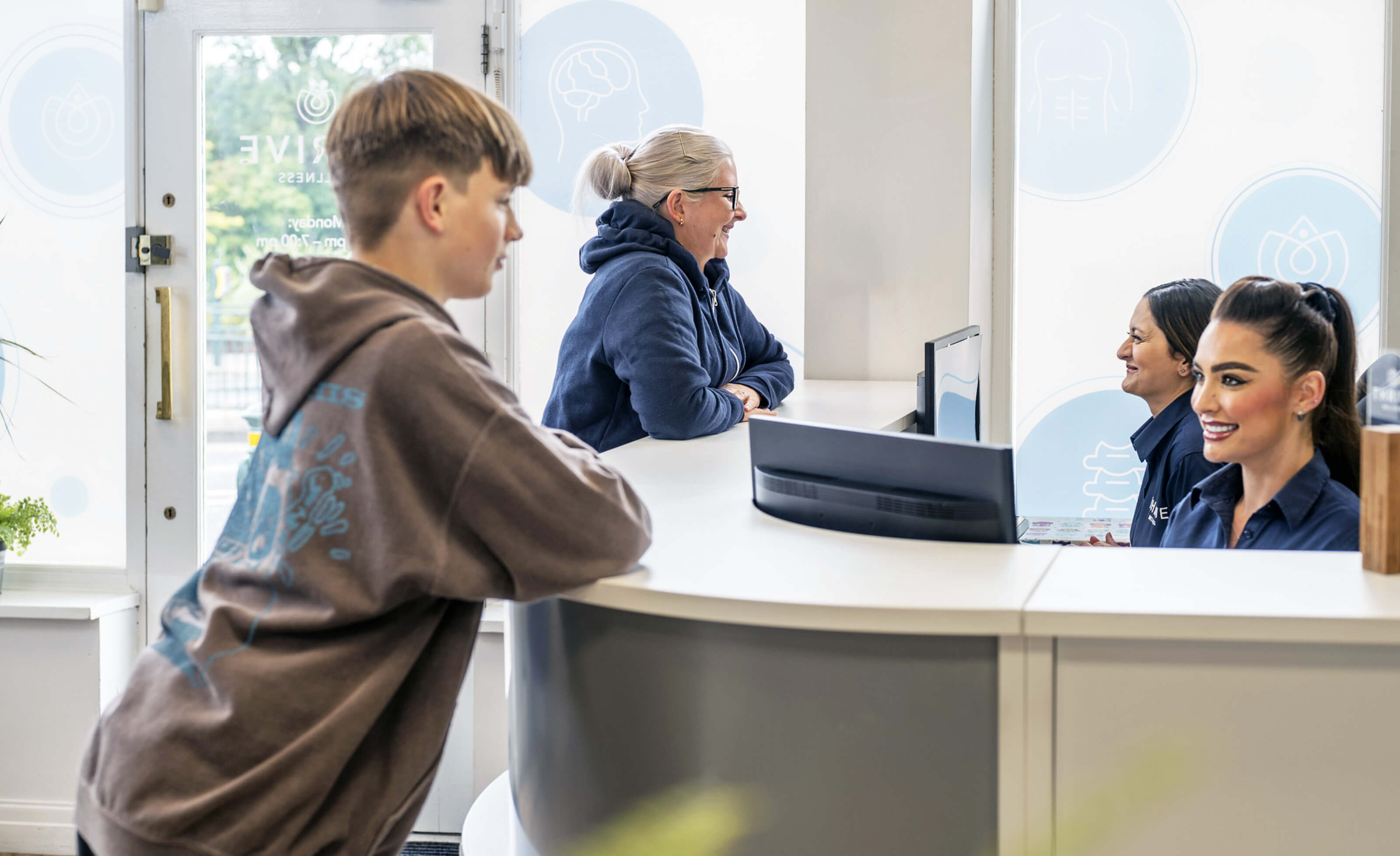 woman having neck adjusted
