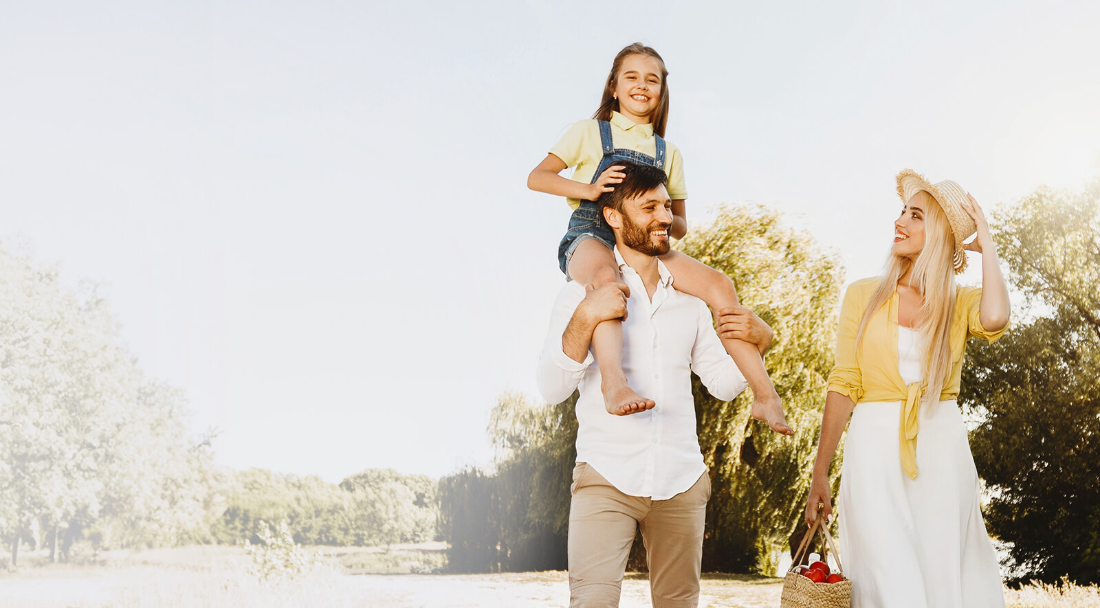 family of 3 walking outdoors