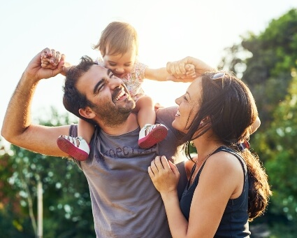 Young smiling family out in nature