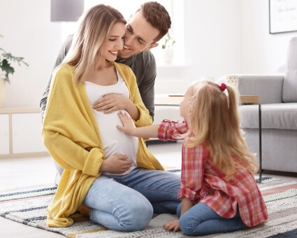 pregnant mom with husband and child