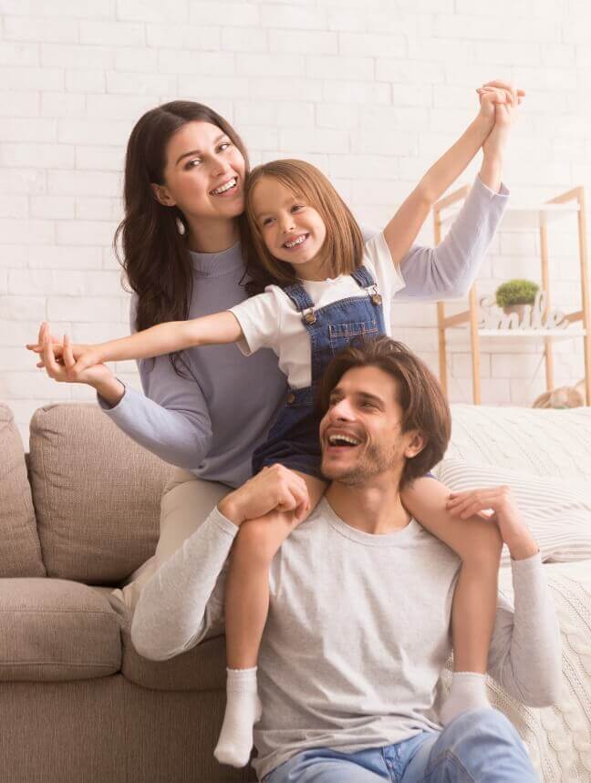 Smiling family of three