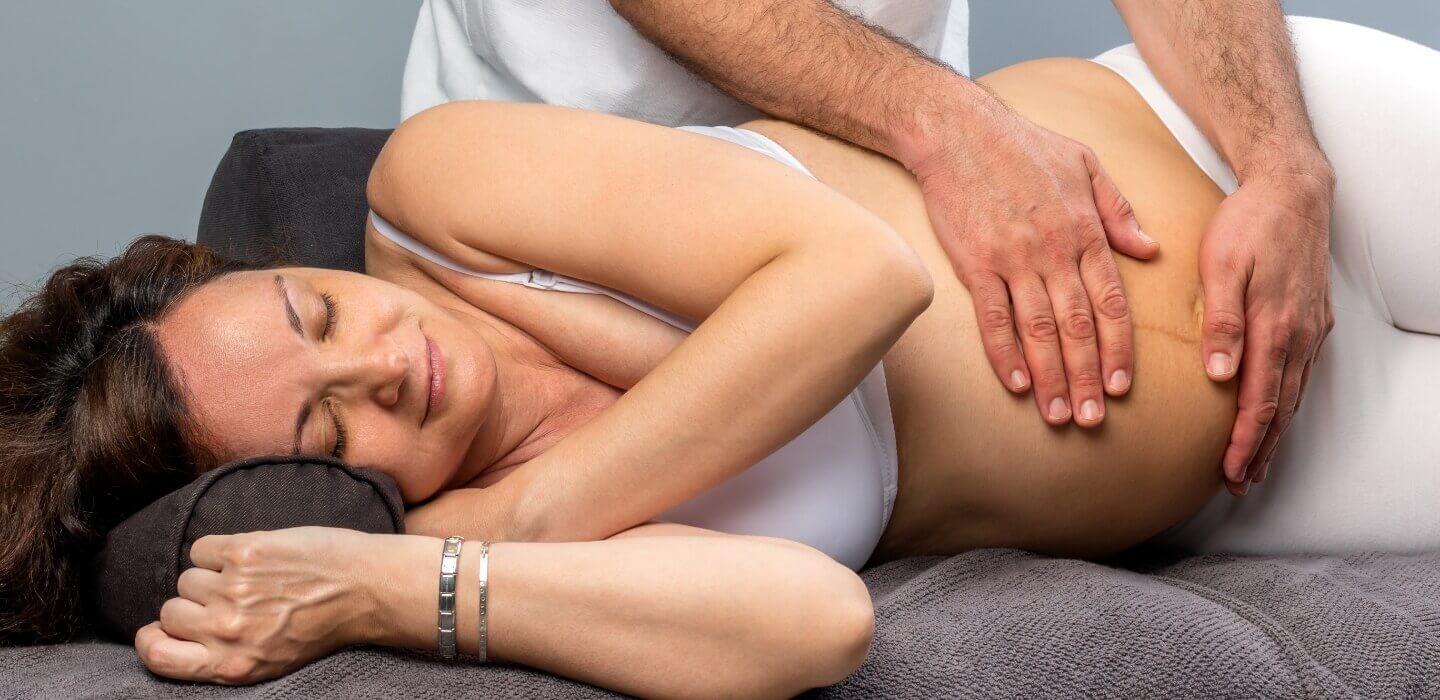 pregnant woman getting adjustment on table