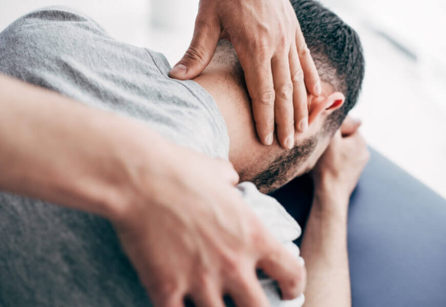 Chiropractor doing neck adjustment