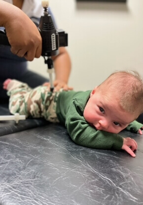 baby on table getting adjustment