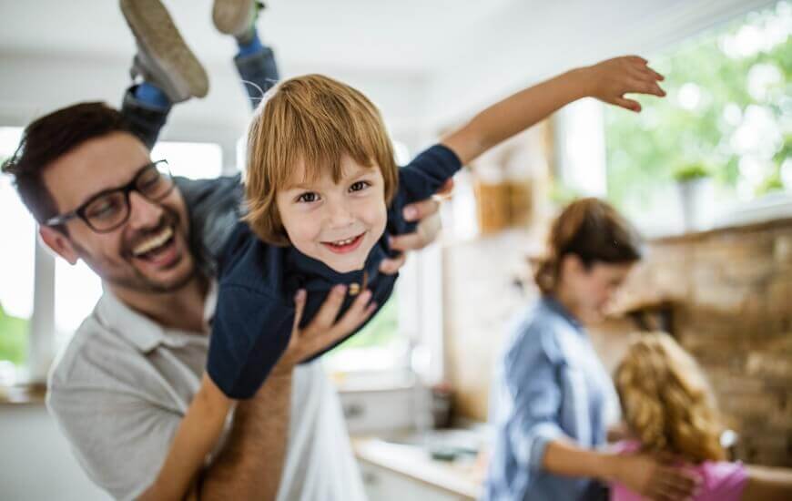 father playing with his son