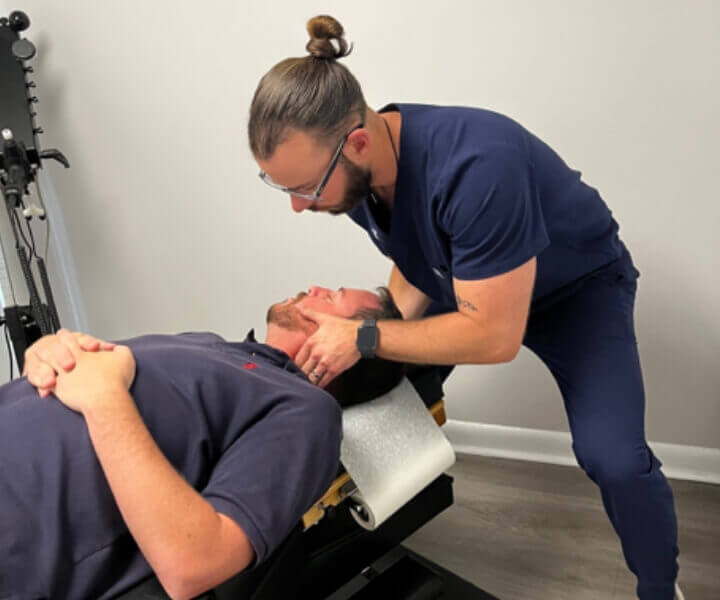 Conshohocken Chiropractor adjusting patient's neck