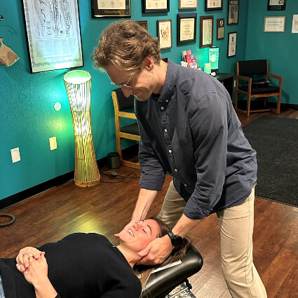 Cook Chiropractic Center doctor adjusting patients neck