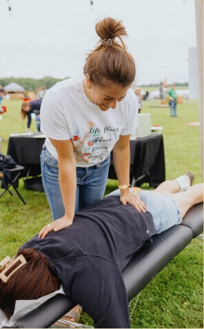 Cook Chiropractic Center patient being adjusted outdoors