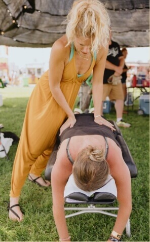 Cook Chiropractic Center practitioner adjusting patient outdoors