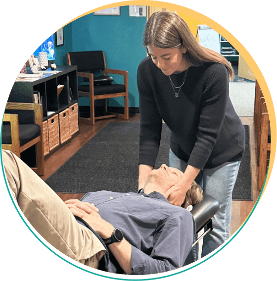 Cook Chiropractic Center practitioner adjusting patients neck